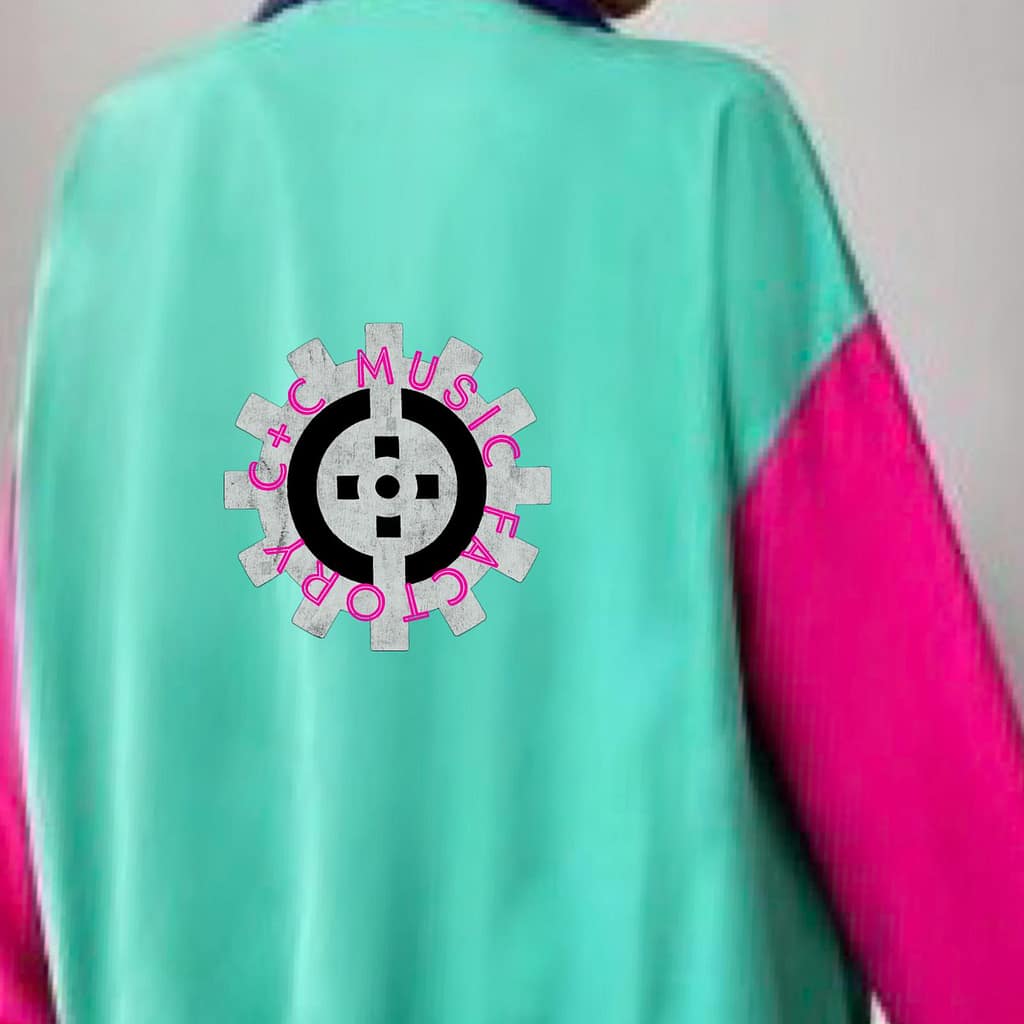 BACK CNC MUSIC FACTORY JACKET FALL SPORTS WINDBREAKER LOGO ON ARM AND BACK COLORS AQUA GREEN BLE WITH YELLOW STRIPES ON TOP HALF PINK ON ARMS